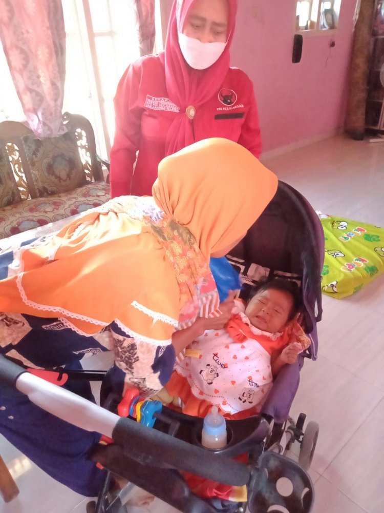 Asmara Kunjungi Balita di desa Way Galih Kec.Tanjung Bintang